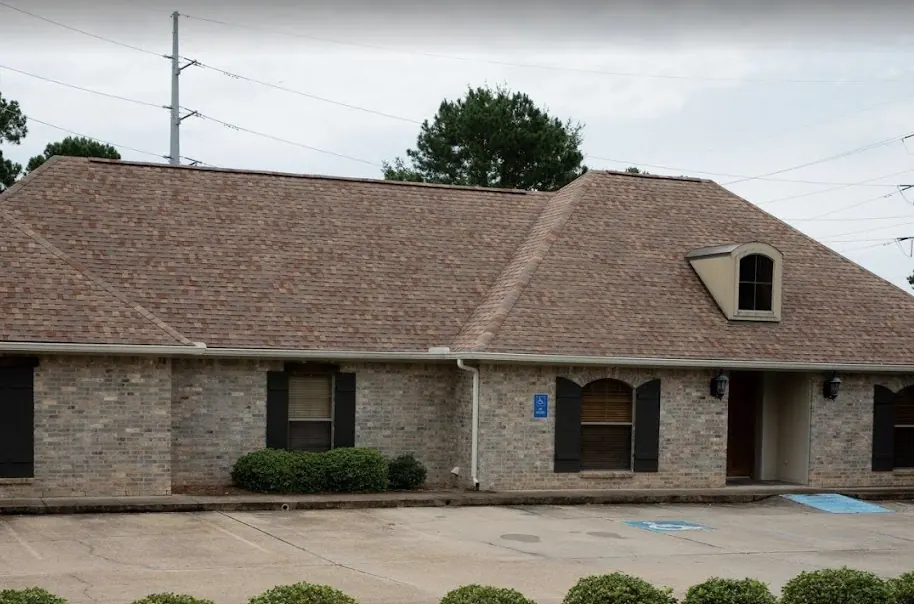 The single-story brick office of Kerst & Caskey Family Dentistry, with parking in front.