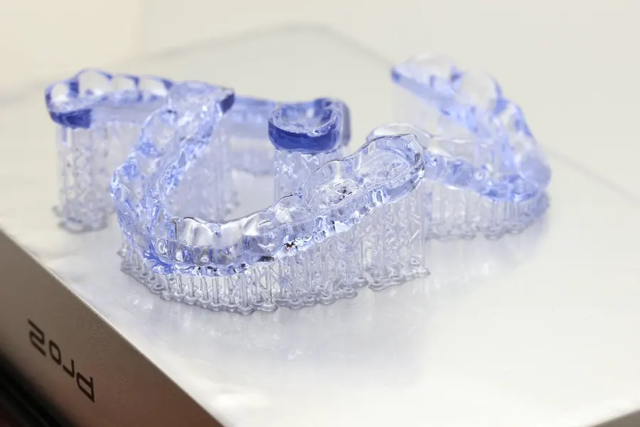 Clear 3D-printed night guards made for TMJ treatment.